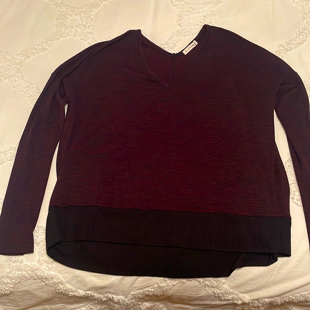 Women’s Rag & Bone size medium light weight maroon sweater with black waistband.